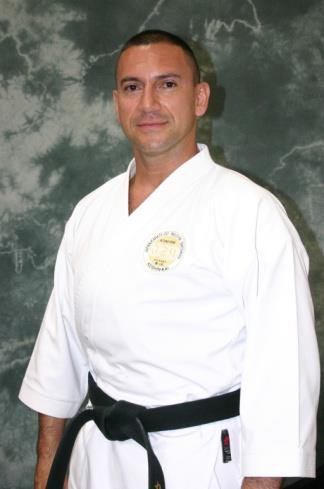 Kyoshi Carlos Quintero in karate gi with black belt