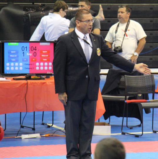 Kyoshi Carlos Quintero officiating at a national karate tournament